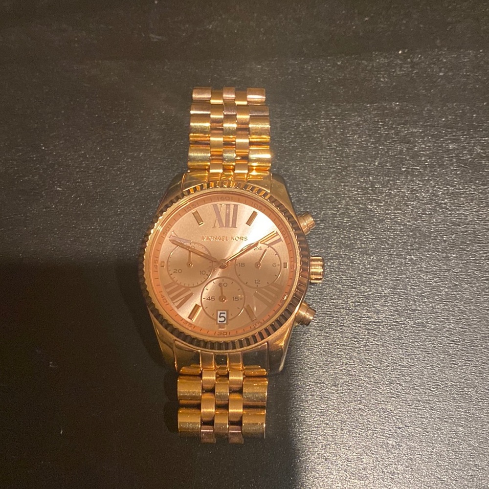 Woman’s rose gold Michael kors watch